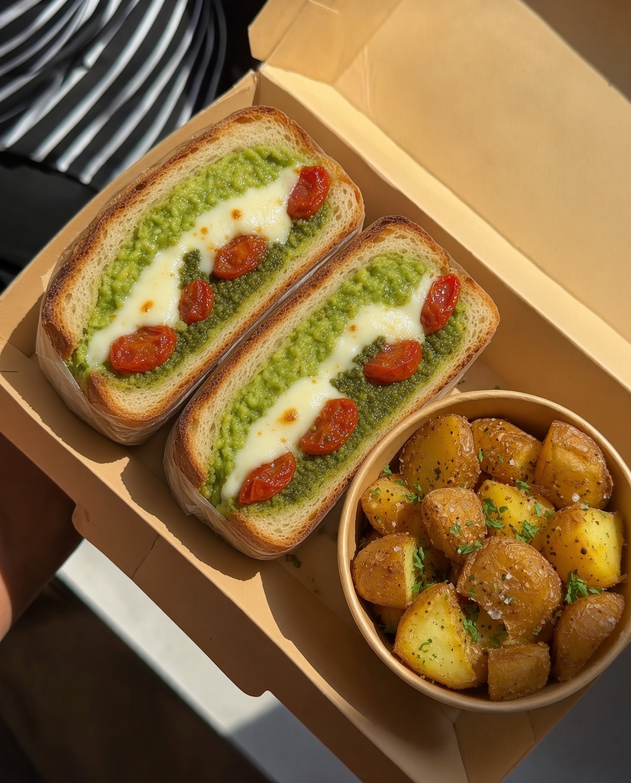 Avo Melt on sourdough in a kraft box
